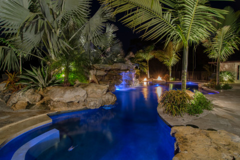 Natural Lagoon pools Swim up bar and seating with natural stone grotto