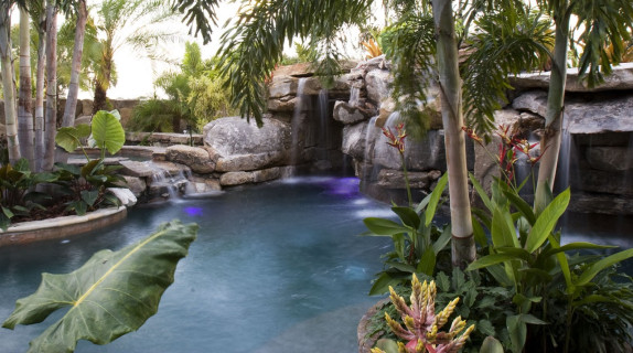 Tropical landscaping surrounding natural lagoon pool