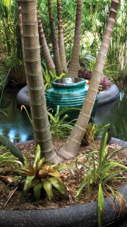 Custom Swimming Pool with Natural Stone Waterfalls and Pool Grotto closeup front water feature