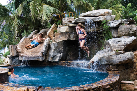 Custom Swimming Pool with Natural Stone Waterfalls and Pool Grotto kids