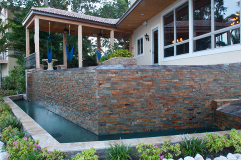 Waterwall and spillway at a modern pool