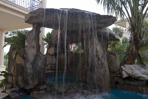 Lagoon Pool with Tall Grotto and Natural Stone Waterfall
