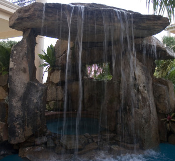 Lagoon Pool with Tall Grotto and Natural Stone Waterfall