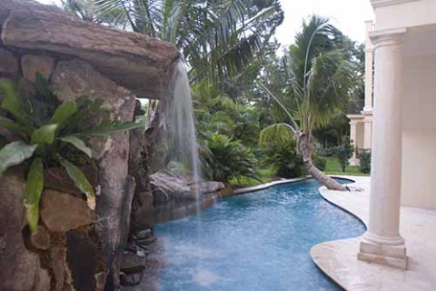 Lagoon Pool with Tall Grotto and Natural Stone Waterfall