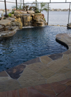 Flagstone deck, waterfall and infinity edge