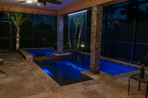View from the house to the modern pool and rain curtain