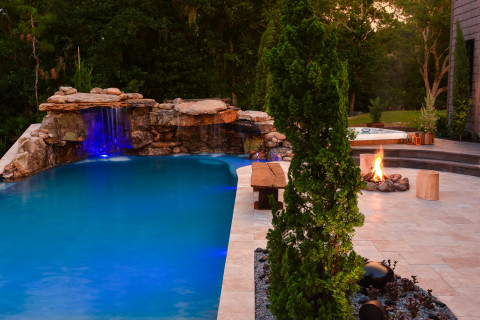 Natural rock lagoon pool and waterfall with large outdoor living space