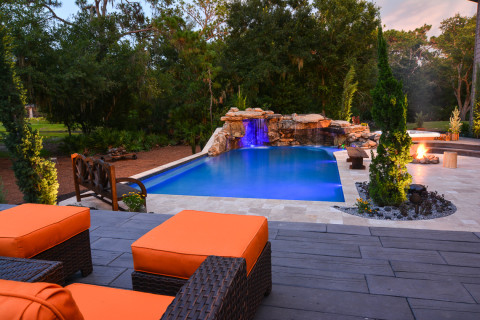 Overview from the top tier of the outdoor living space and natural stone lagoon pool complete with outdoor furnishings