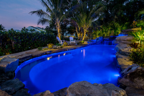 Lagoon Pool and Tiki Hut area over looking the canal view at night