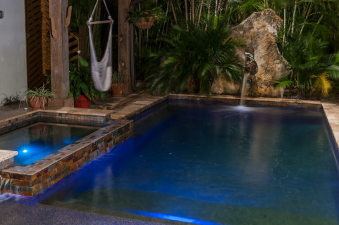 Modern pool and spa with water feature