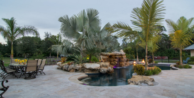 Lagoon Pools Outdoor Living Design shallow swim up bar pool rock waterfalls