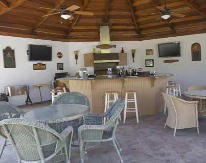 Large outdoor kitchen under a timber gazebo