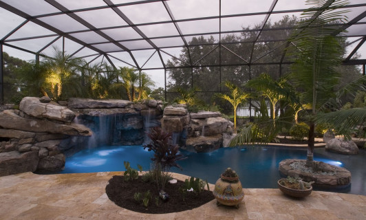 Travertine deck surrounding lagoon pool