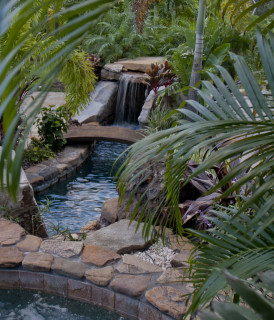Natural Stone Grotto Waterfall with Elevated Spa Bridge Lucas Lagoons