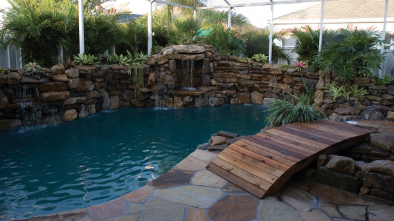 lucas lagoons pool remodel with wooden bridge after