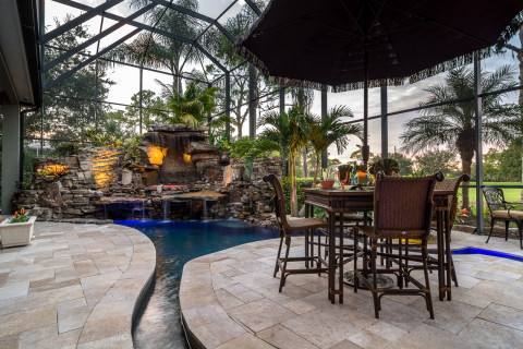 Golf course lagoon pool with travertine island