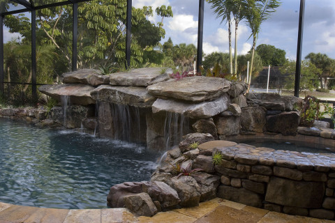 Pool Remodel with Stone Grotto Waterfall and Stone Spa