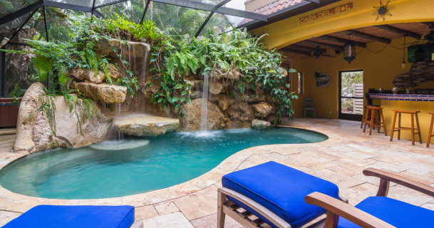 Large travertine deck Siesta Key lagoon pool