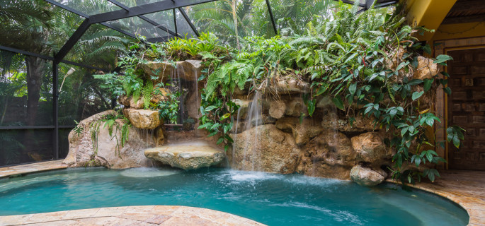 Tropical landscaping on a natural lagoon Siesta Key pool