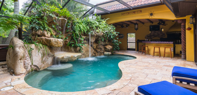 Travertine deck and outdoor kitchen Siesta Key lagoon pool