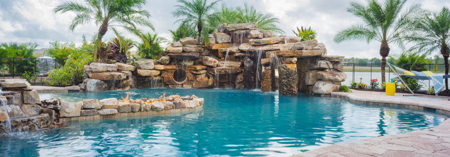 Backyard or Waterpark? Image of timthumb.php?src=https%3A%2F%2Flucaslagoons.com%2Fwp content%2Fgallery%2Fsliding into neverland custom pool at the concession%2FCustom pool the concession bradenton 2.jpg&h=320&q=90&f= Custom-pool-the-concession-bradenton--2