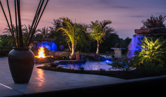 Sunset view of outdoor living space with two lagoon pools