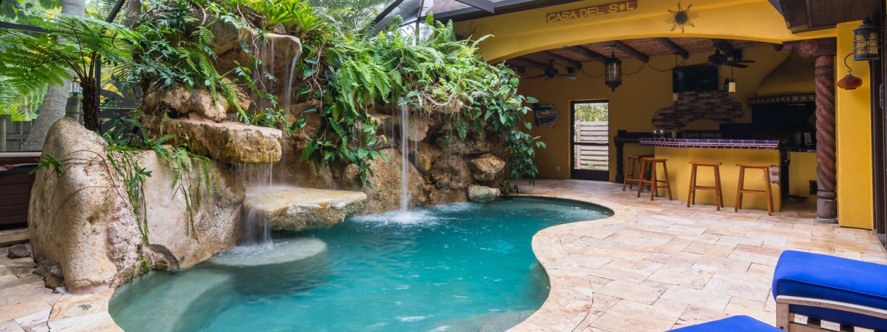 Designer Series Semi-Custom Pools siesta key caribbean limestone outdoor living kitchen Sarasota pool