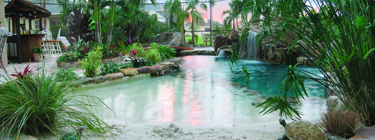 Image of Lagoon Pool with Sand Bottom Entrance and Bridge